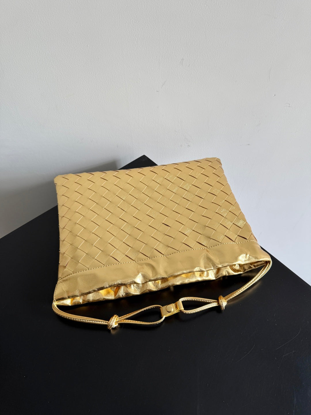 Bottega Veneta 2026 Dust Bag Gold Laminated Leather